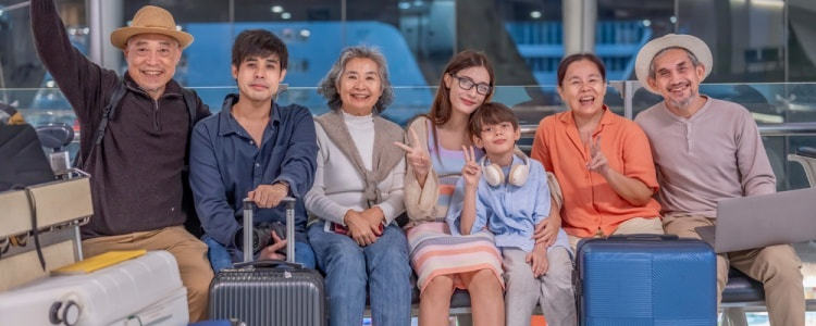 Happy family waiting for their flight at an airport